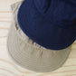 HIGHER - 
COTTON LINEN VINTAGE BACKSATIN CINCH BUCKLE CAP