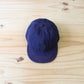 HIGHER - 
BLUE SELVEDGE DENIM CINCH BUCKLE CAP