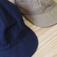HIGHER - 
COTTON LINEN VINTAGE BACKSATIN CINCH BUCKLE CAP