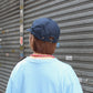 HIGHER - 
COTTON LINEN VINTAGE BACKSATIN CINCH BUCKLE CAP